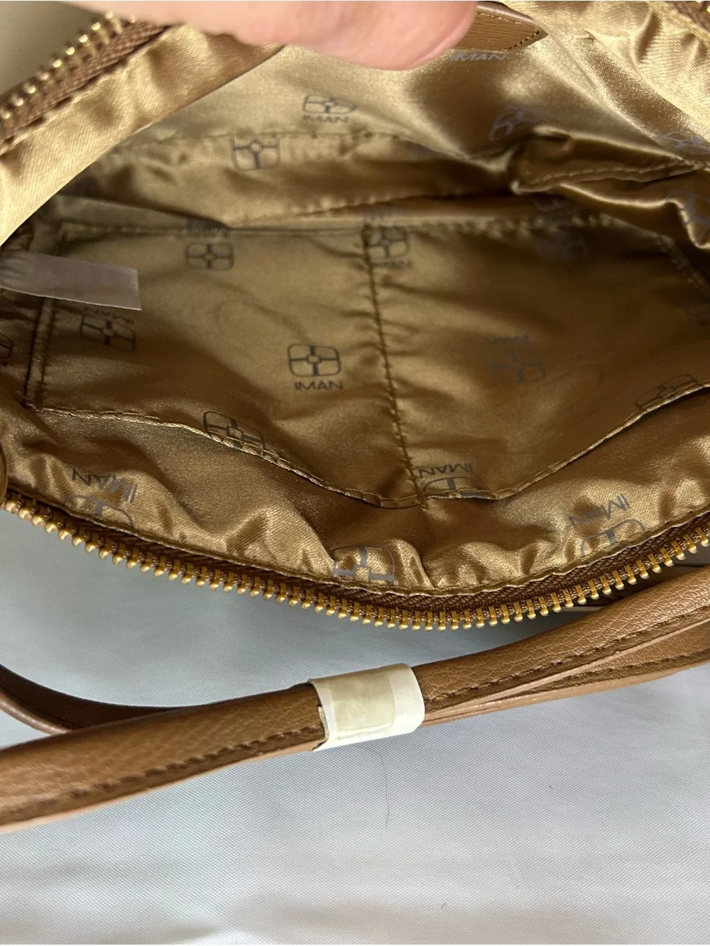 IMAN Quilted Tan Crossbody with Gold Medallion